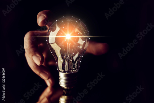 man hand choose glow light bulb creativity business ideas concept black backgrou Tapéta, Fotótapéta