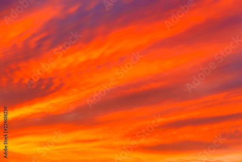 Sky with clouds in sunset time. Blurred background - sunset colors . © Inna