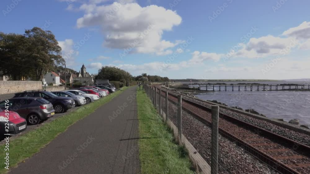 Railway track beside the Fife coastal path at the historic village of Culross on the north shore of the River Forth. Hand-held walk. Railway track beside the Fife coastal path at the historic village of Culross on the north shore of the River Forth. Hand-held walk.