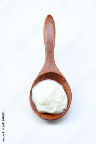 
Fresh yogurt on wooden spoon for beauty skin.