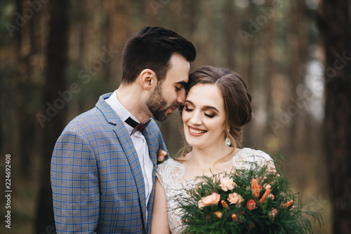 Happy bride and groom in the forest .  Autumn. The concept of a Rustic wedding style