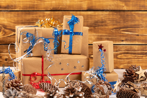 christmas present with ribbonchristmas presents with ribbon with wooden rustic background photo