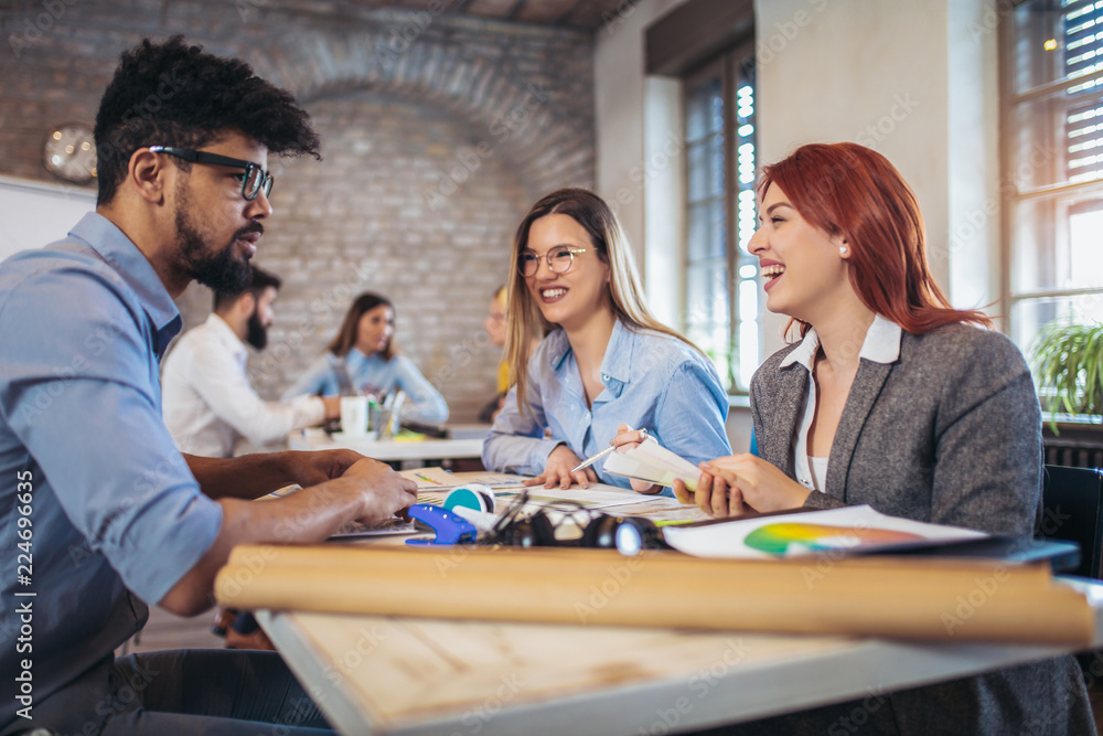 Group of young business people in smart casual wear working together in creative office Group of young business people in smart casual wear working together in creative office