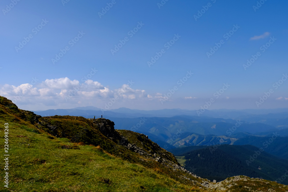 hikers on the background of mountains, autumn Carpathians