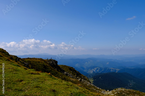 hikers on the background of mountains, autumn Carpathians