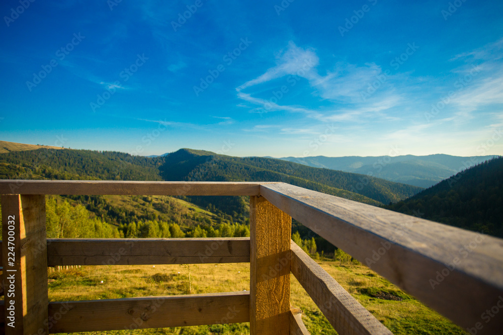 Beautiful landscape of summer mountains with blue sky. Autumn mountain village panoramic landscape