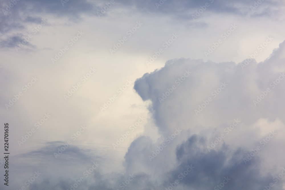 White creamy clouds in the sky as a background White creamy clouds in the sky as a background