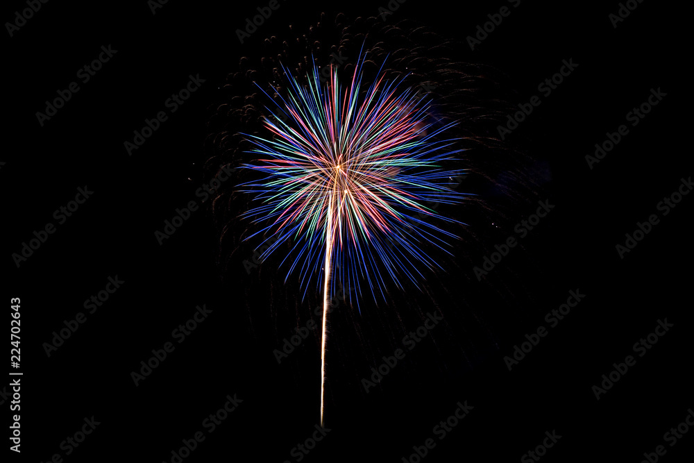 Colorful explosion fireworks isolated on black background at night sky.