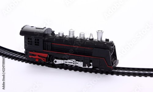 toy locomotive on the railroad tracks