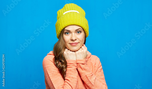 Smiling young woman in casual street style clothes.