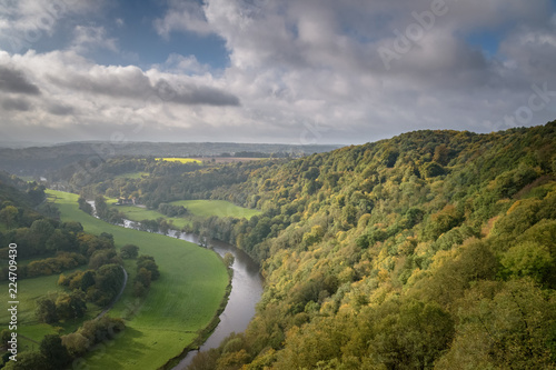 Beautiful autumn colored forest in Belgium with the Ourthe river photo