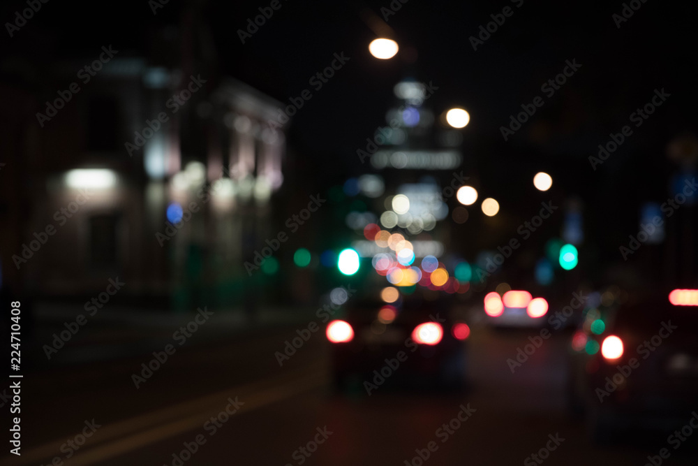 Texture of bokeh from traffic of light fires of the night city against a dark background. Motion blur Texture of bokeh from traffic of light fires of the night city against a dark background. Motion blur