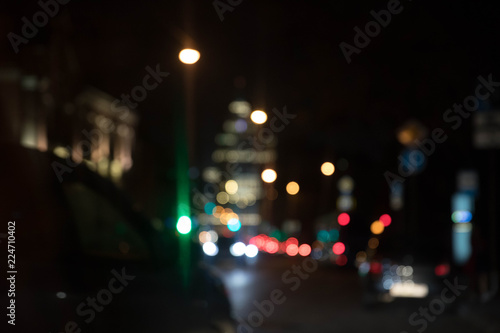 Texture from traffic of light fires of the night city against a dark background. Motion blur