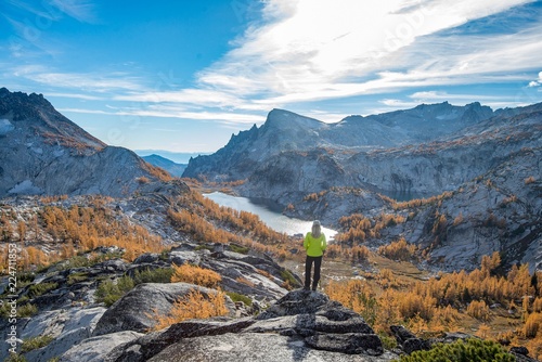 A woman takes in the view at the Enchantments with peak fall color