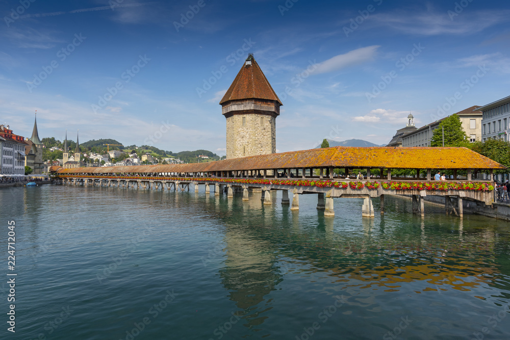The famous Kapellbrucke (Chapel Bridge) wooden footbridge across the Reuss River in the city of Lucern, Switzerland.