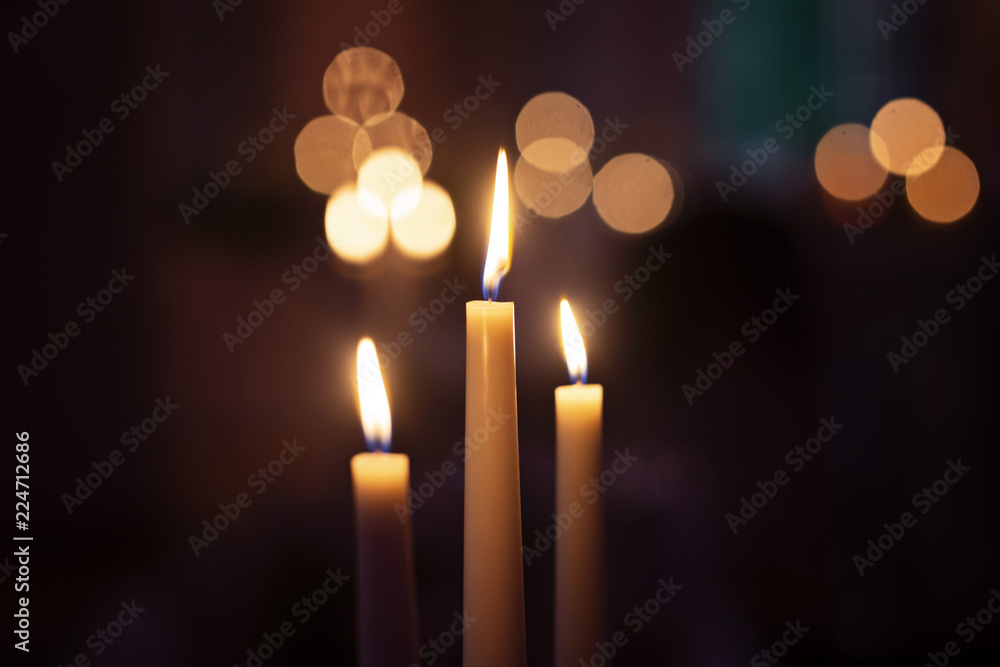 The Candles Burning with bokeh in the background The Candles Burning with bokeh in the background