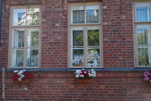 Brick house decorated with flowers 