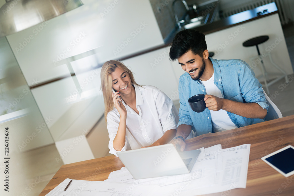 Handsome young man and attractive woman working on laptop Handsome young man and attractive woman working on laptop