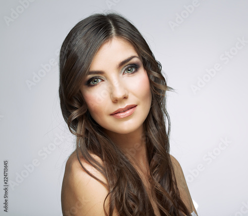Close up face portrait in beauty style of young woman with curly