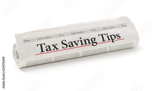 Rolled newspaper with the headline Tax saving tips