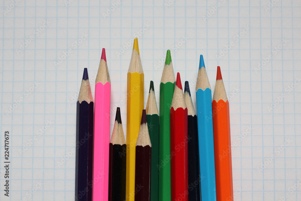 Close-Up Of Colored Pencils On white Paper Close-Up Of Colored Pencils On white Paper