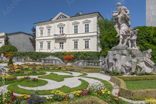 Sculpture of Anchises by his son Aeneas from the burning Troy, Mirabell palace in Mirabellgarten (Mirabell gardens), Salzburg, Austria. photo