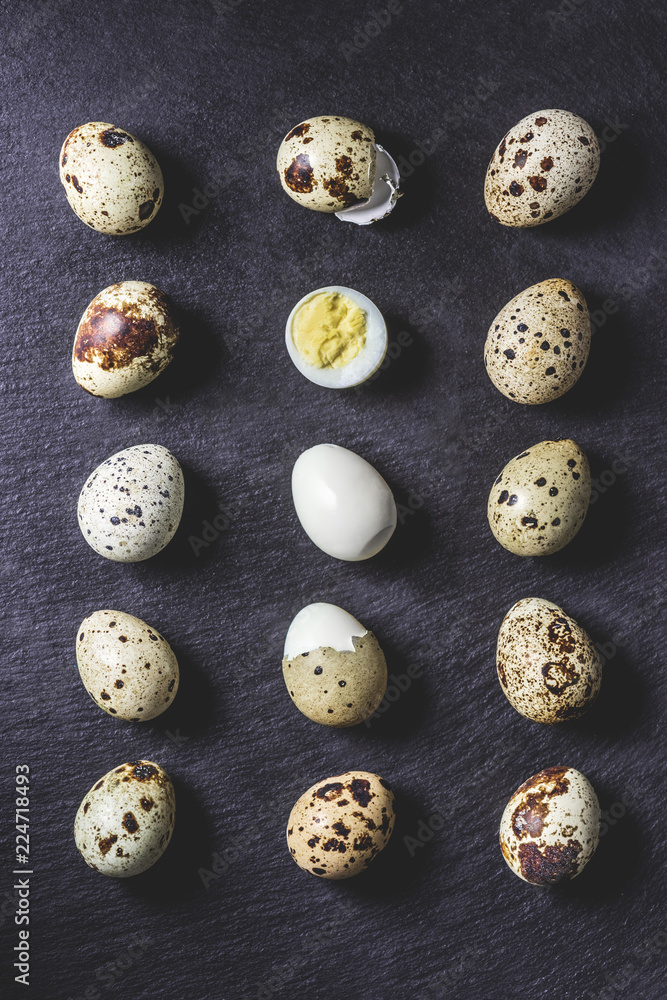 top view of healthy boiled quail eggs on black background