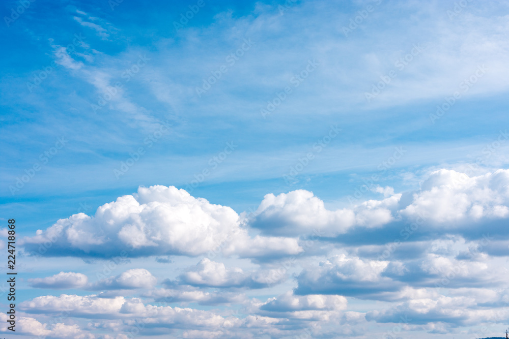 White fluffy clouds on a blue sky White fluffy clouds on a blue sky