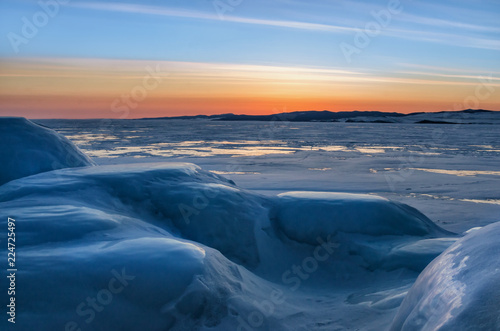 View of beautiful drawings on ice from cracks and bubbles of deep gas on surface of Baikal lake in winter  Russia