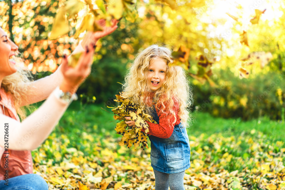 Mother with her little daughter have fun in the park. Mother with her little daughter have fun in the park.