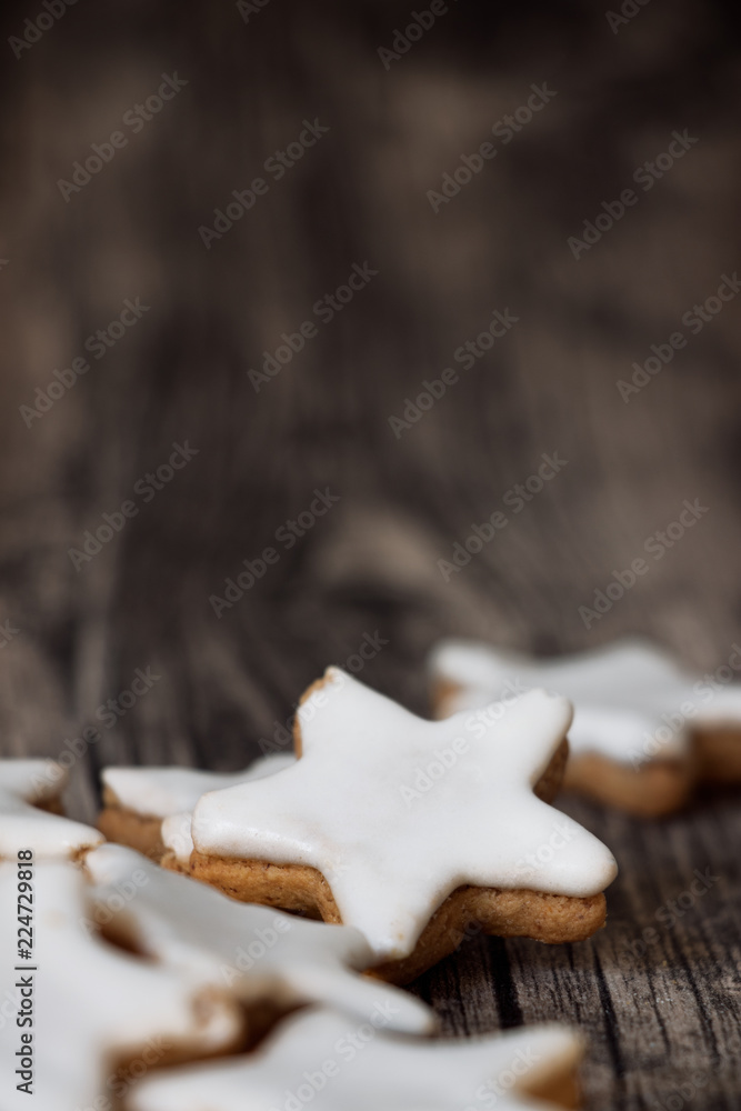 traditional cinnamon stars on dark wooden background traditional cinnamon stars on dark wooden background