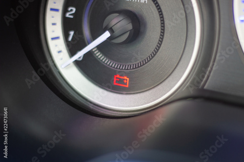 Car Dashboard Symbols and warning lights show battery warning light in-car dashboard