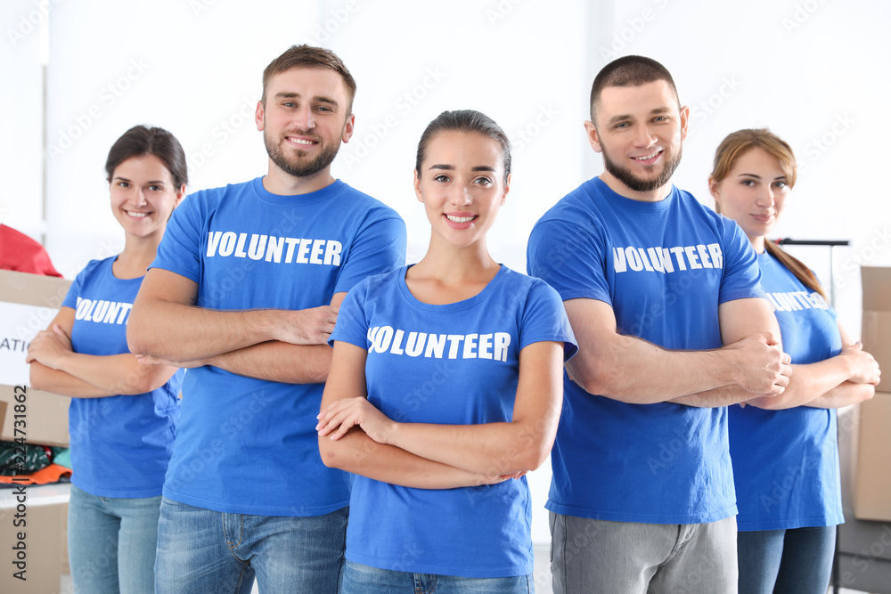 Obraz premium Team of young volunteers indoors. Collecting donations
