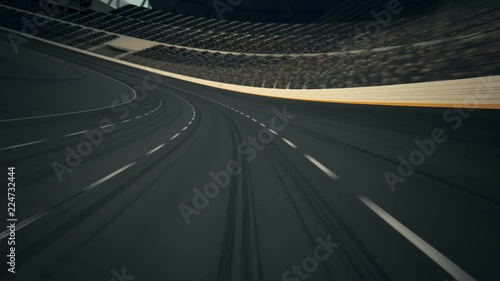 POV Race Car Speeding Along The Curve Racetrack on stadium during sport event. photo