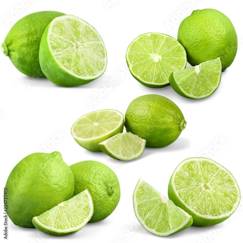 Photo Set of fresh limes isolated on white