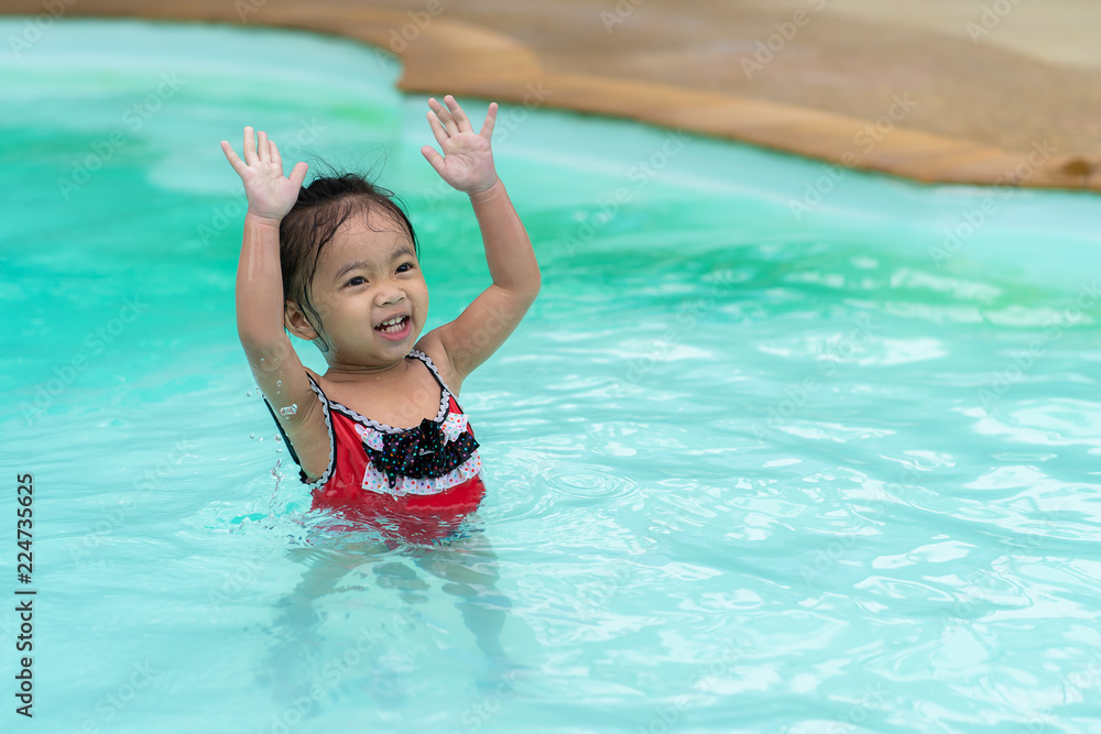 Happy baby Asian girl in swimming pool Happy baby Asian girl in swimming pool