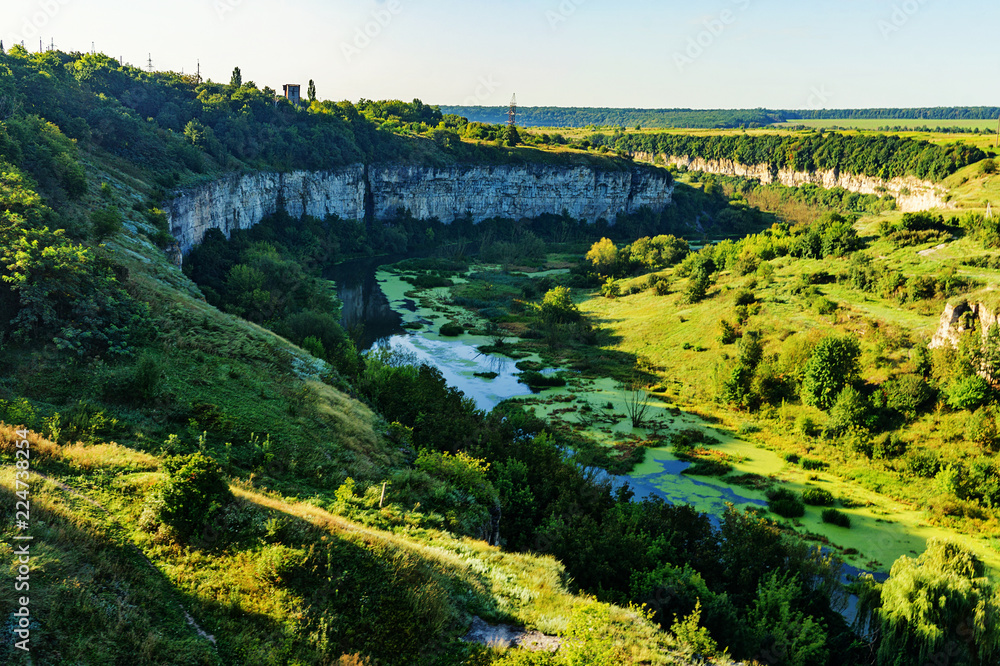 Obraz premium Rocky shore of the river canyon in summer