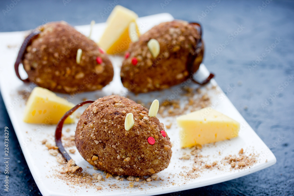 Mice cakes - funny and spooky Halloween dessert idea for kids, edible mouse cookies with red eyes and almonds ears, cute rat cakes Mice cakes - funny and spooky Halloween dessert idea for kids, edible mouse cookies with red eyes and almonds ears, cute rat cakes