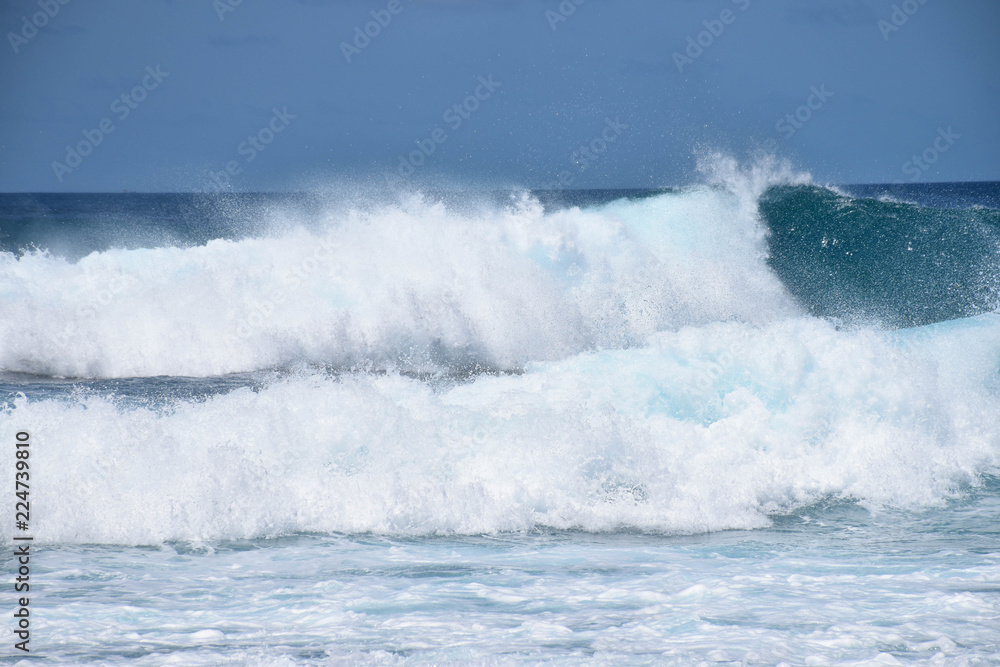 Huge waves crashing down into a frothy ocean, Pasta Point, Maldives.