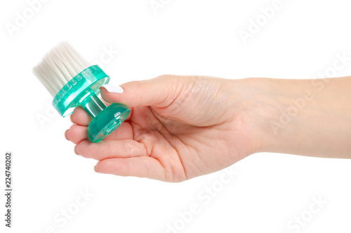 Manicure brush in hand on white background isolation