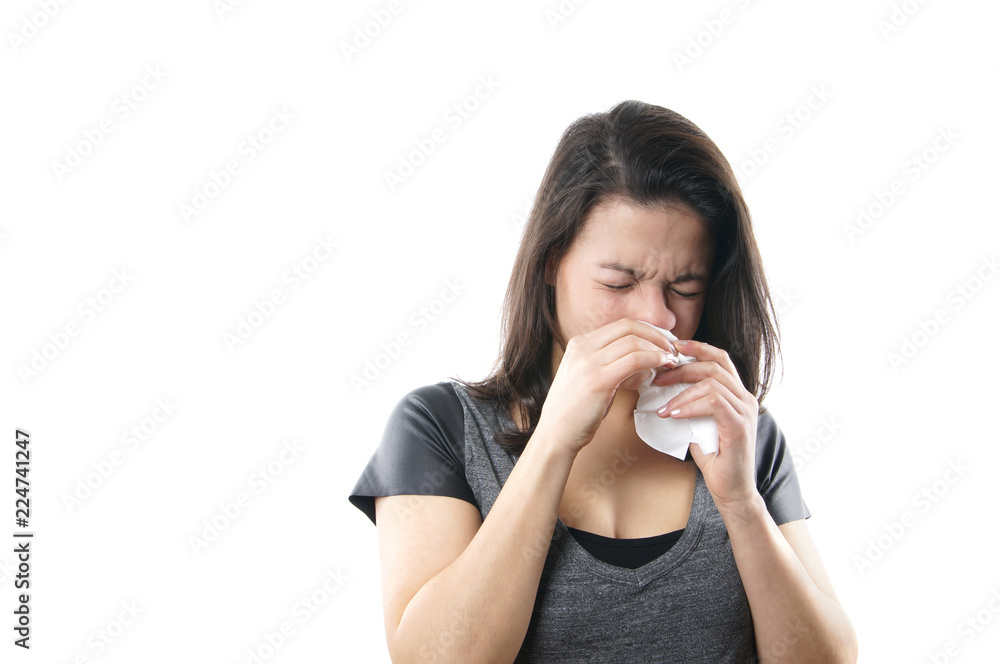 young woman blowing nose with paper tissue young woman blowing nose with paper tissue