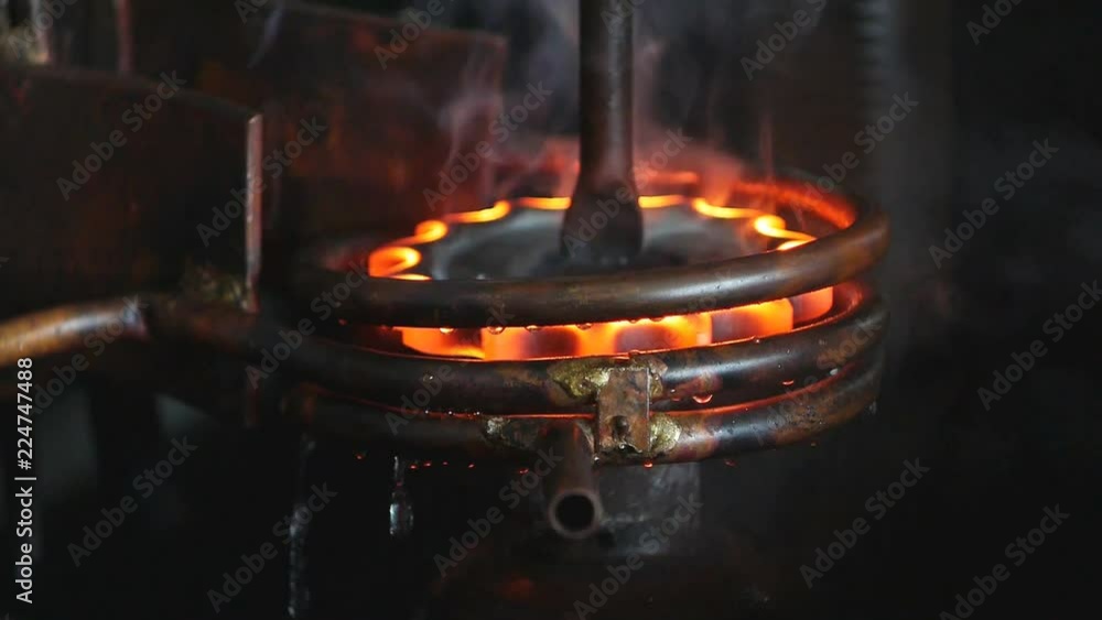 Hardening and heat treatment of metal parts for mechanical engineering, close-up, heat treatment of metal parts and products on a call, close-up, industry, harding Hardening and heat treatment of metal parts for mechanical engineering, close-up, heat treatment of metal parts and products on a call, close-up, industry, harding