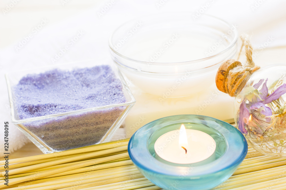Spa and wellness setting with oil and yellow flower Spa and wellness setting with oil and yellow flower