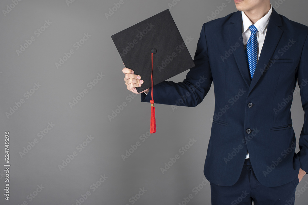 business man is holding graduation hat, business education concept business man is holding graduation hat, business education concept