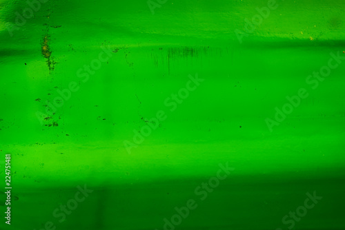 Texture of green old bottle glass with scratches