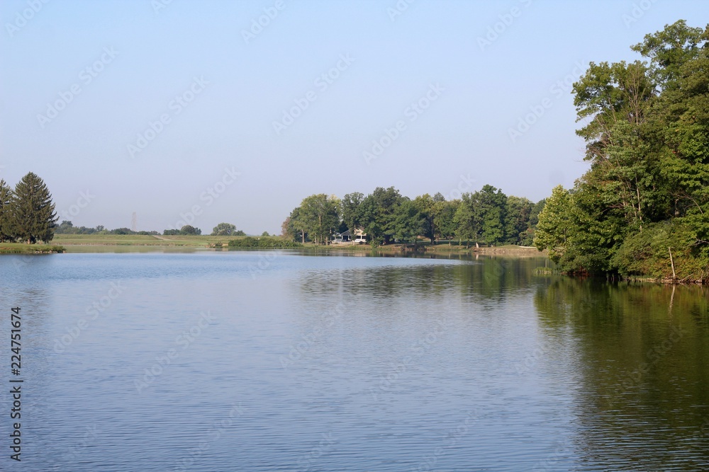 A beautiful view of the lake in the park on a clear morning.