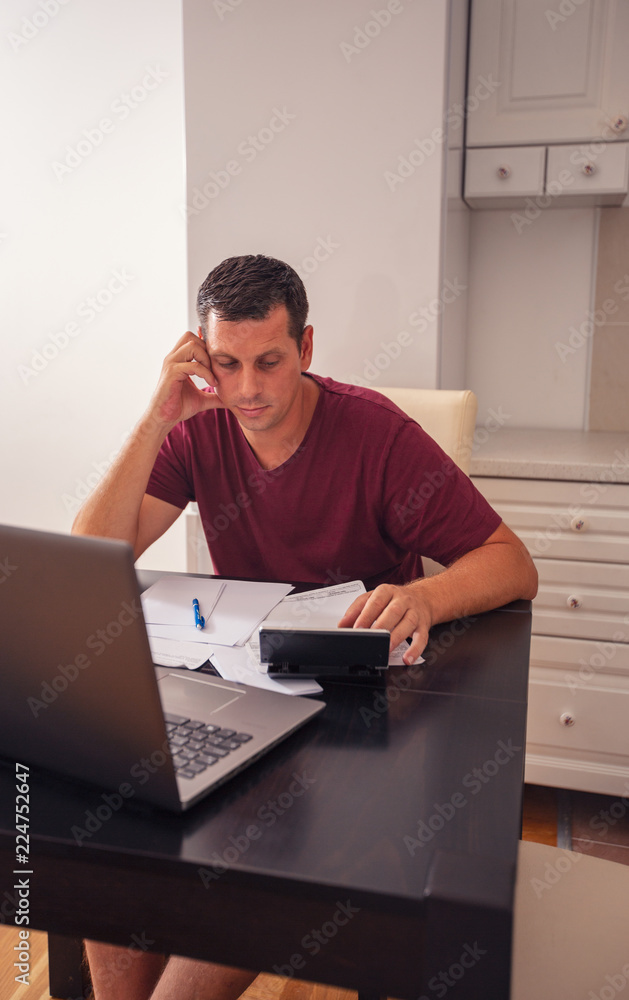 man at home planning family budget and finances.. man at home planning family budget and finances..