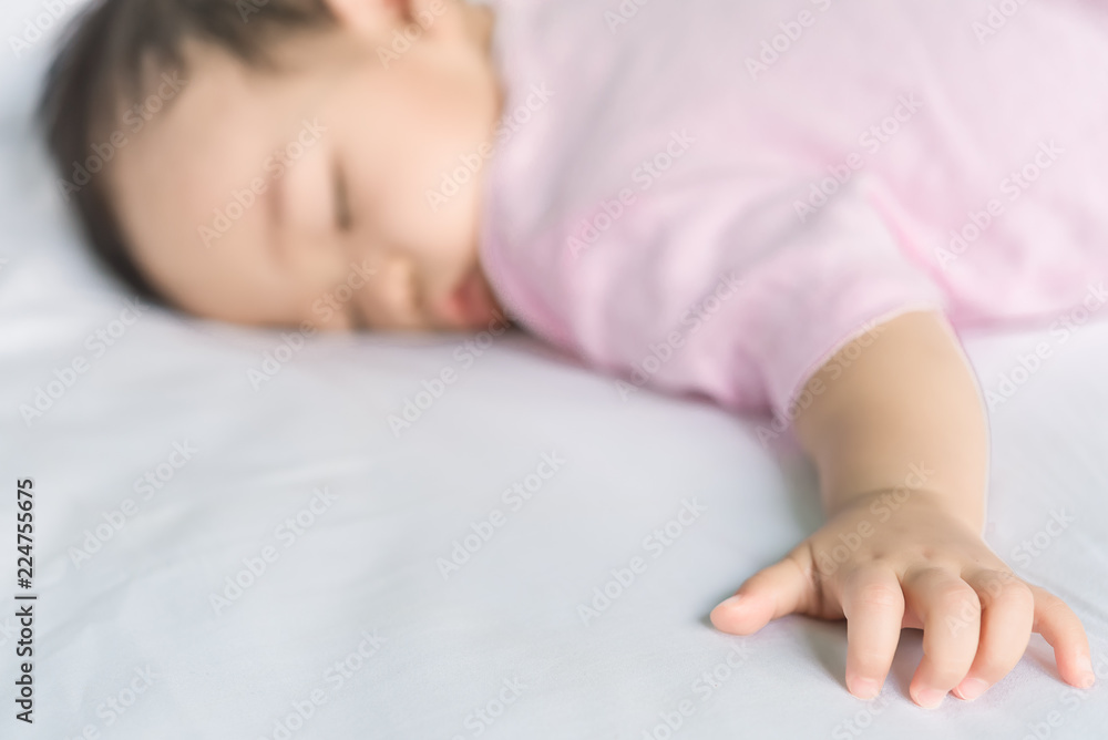 Asian baby sleeping on the bed,thailand people,relax time Asian baby sleeping on the bed,thailand people,relax time