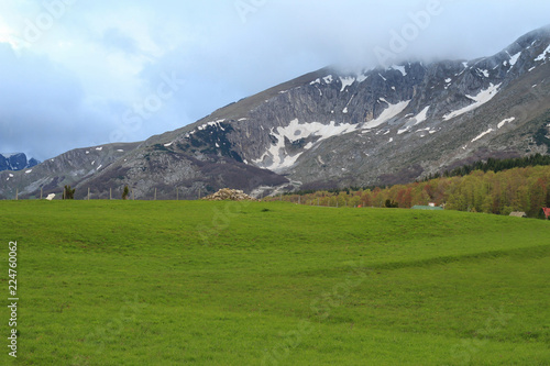 Mountains and clouds ,valley, snow,springtime , Wild untouched nature beauty. Peaceful place in nature, Relax, mind reset concept. Durmitor Montenegro.