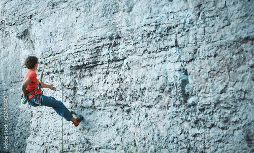 man rock climber climbing on the cliff